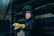 © ysbrandcosijn - Portrait of welder with beard in workplace