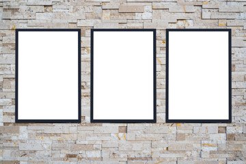 three white poster on grey stone wall