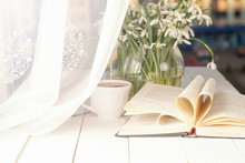 White Crocus With Open Book On Windowsill Background