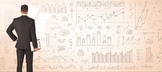 Businessman with diagrams and graphs