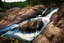 Small Waterfall And Rock In Forest In Karelia