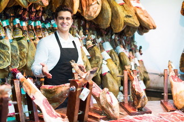 Wall Mural - Seller in delicatessen section