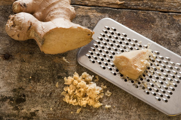 Fresh ginger root and grater