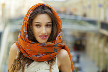 Wall Mural - Close up portrait of a muslim young woman wearing a head scarf