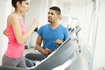 Wall Mural - Young people training in the gym