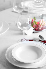 Poster - Table set at restaurant on light background