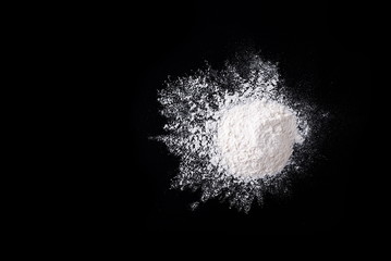 flour on the black background