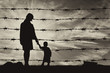 © Prazis Images - Silhouette of hungry refugees mother and child