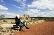 © sigitas1975 - Woman seating at roman ruins Wroxeter