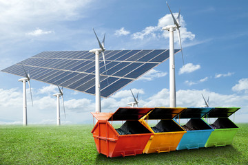 solar panels,wind turbines, industrial waste bin(dumpster) on gr