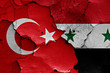 flags of Turkey and Syria painted on cracked wall