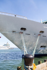 Canvas Print - Black Bollard with Ropes to Cruise Ship