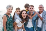 Happy family posing at the beach