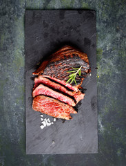 fried steak on a dark background