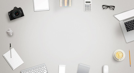 Leinwandbilder - Work desk with free space for text surrounded with a lot of desk accessories. There is a laptop, tablet, phone, camera, headset, mouse, glasses, camera, pens, paper...