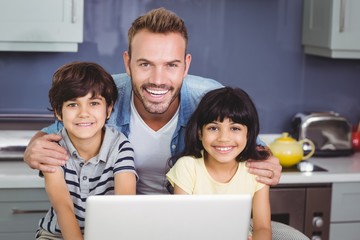 Wall Mural - Portrait of smiling father with children 