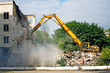 Excavator demolishes the old soviet residential house in Moscow