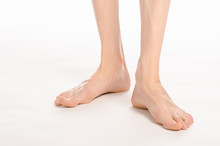 Pedicure And Foot Care Topic: The Naked Man's Legs Isolated On White Background In Studio