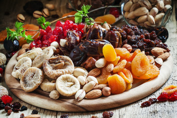 Wall Mural - Mix dried fruits and nuts, healthy diet, eating lean, old wooden