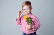 © tkovbasovska - A cute little boy is dressed in a checked pink shirt and glasses