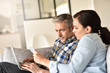 © goodluz - Couple in sofa websurfing and shopping on internet