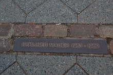 "Berlin Wall"
A Marker On The Ground Of Berlin, Germany To Indicate Where The Berlin Wall Once Stood