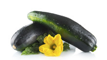 Mature Zucchinis With Flowers On White Background