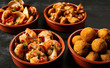 Four bowls of Spanish appetizers