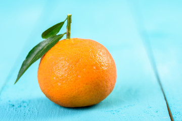 Wall Mural - Fresh Tangerine On Blue Table