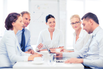 Poster - business team having meeting in office