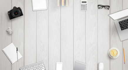 Leinwandbilder - Work desk with free space for text surrounded with a lot of desk accessories. There is a laptop, tablet, phone, camera, headset, mouse, glasses, camera, pens, paper...