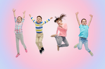 Wall Mural - happy little children jumping in air