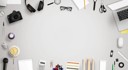 Leinwandbilder - Work desk with free space for text surrounded with a lot of desk accessories. There is a laptop, tablet, phone, camera, headset, mouse, glasses, camera, pens, paper...