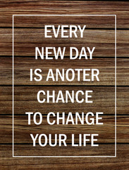 Motivational poster quote on rustic wooden background - Every new day is another chance to change your life