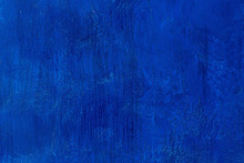 Old Scratched And Chapped Painted Royal Blue Wall. Abstract Textured Colored Background, Empty Template