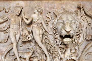 Wall Mural - Bas-relief and sculpture of ancient Roman Gods and a lion head