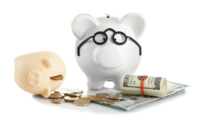 Poster - Piggy bank in glasses with dollars and coins isolated on white