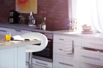 Sticker - Modern kitchen interior with white furniture and electric stove