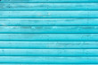 Section of turquoise panelling from a beach hut, suitable for backgrounds of beach, seaside and summer holiday themes.