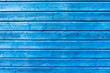Section of blue wood panelling from a beach hut, suitable for backgrounds of beach, seaside and summer holiday themes.