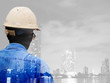© Yuttana Studio - Double exposure of a businessman man survey and civil engineer s