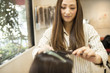 © Monet - Young women are coloring their hair at the beauty salon