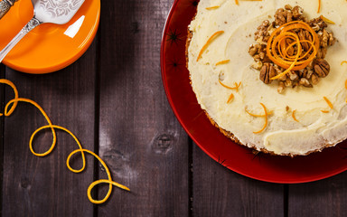 Wall Mural - American carrot cake on dark wooden background 