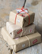 Pile of little packages to ship on wooden background