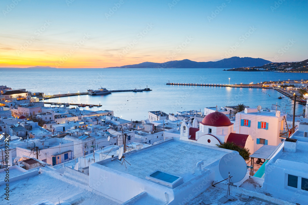 View of Mykonos town and Tinos island in the distance, Greece. - obrazy, fototapety, plakaty 