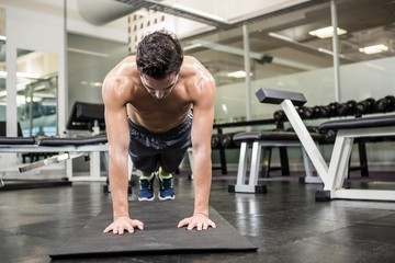 Wall Mural - Shirtless man doing push up