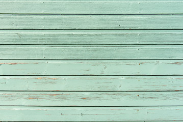 section of pale green wood panelling from a seaside beach hut. could be used as a background to illu