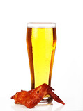 Fototapeta Boho - glass of beer with grilled wings on a white background