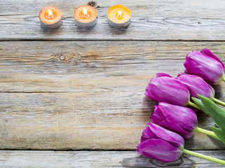 Wall Mural - Candles with flower on wooden background