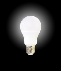 glowing white LED light bulb, isolated on black background 